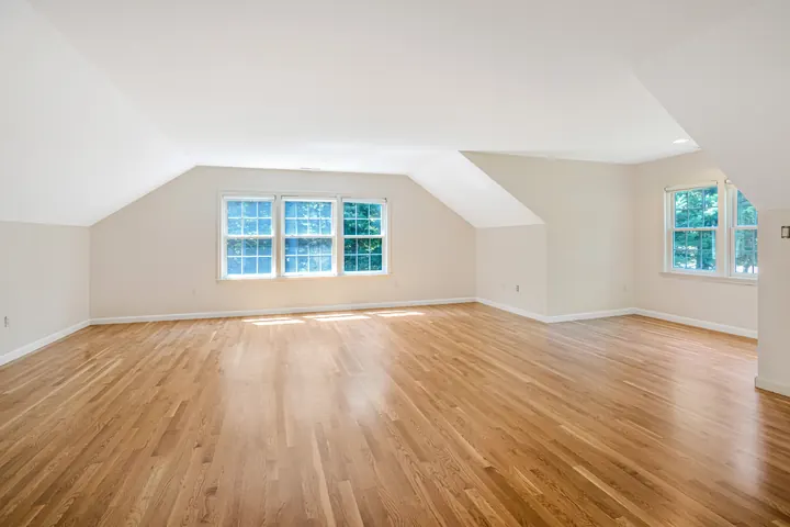 The same Bedford, NH bonus room after LCH removed the carpet and sanded and refinished the hardwood floor