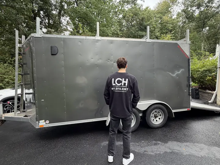 Jacob Cunningham of LCH standing at the back of the LCH work trailer in a Londonderry, NH driveway