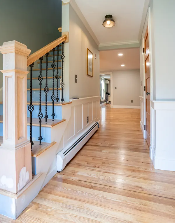 Front hall and staircase with refinished oak floors